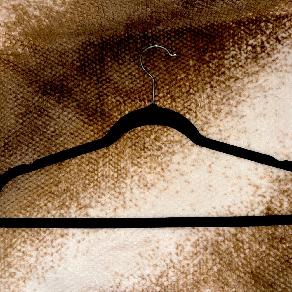 100 black, sturdy, velvet hangers. Perfect for boutique owners.